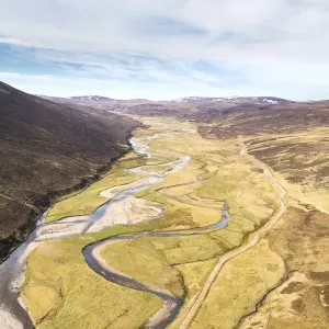 Aerial view of the upper River Dulnain running through open moorland, Monadhliath mountains, Highlands, Scotland, UK. May, 2020 Aerial view of the upper River Dulnain running through open moorland, Monadhliath mountains, Highlands, Scotland, UK. May, 2020