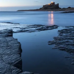 Bamburgh Castle, early morning light at dawn, Bamburgh, Northumberland, UK, April 2013 Bamburgh Castle, early morning light at dawn, Bamburgh, Northumberland, UK, April 2013