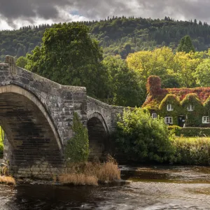 Bridge and ivy covered cottage, LLanwrst, Conwy Valley, at the edge of the Snowdonia National Park