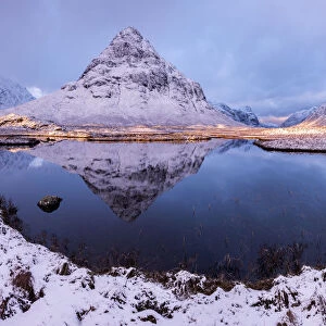 Buachaille Etive Beag reflected in Lochan na Fola after snowfall, early morning light