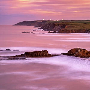 Bude breakwater and coastal view looking North at high tide and sunrise. Cornwall, UK. January
