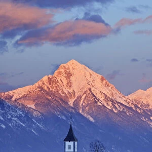 Church of St. Primoz with the Kamnik-Savinja Alps beyond, . January 2010