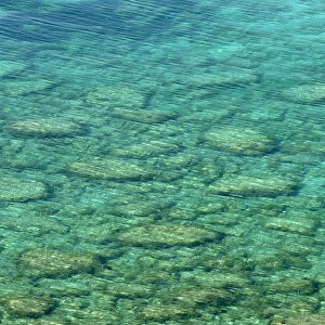 Clear sea water showing stones beneath surface, Karpaz Peninsula, North Cyprus, April