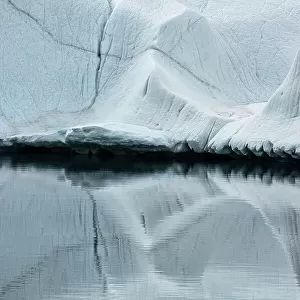 Close up of an iceberg reflected in the water, Ross Sea, Antarctica. January 2000