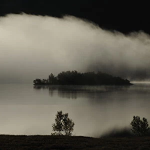 Clouds over lake, Forollhogna National Park, Norway, September 2008