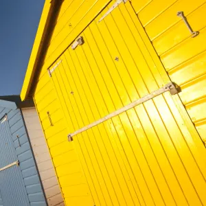 Colourful beach huts in early morning light. Dawlish Warren, South Devon, UK, February