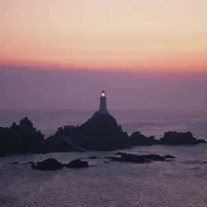 Corbiere lighthouse at sunset, Jersey, Channel Islands Corbiere lighthouse at sunset, Jersey, Channel Islands