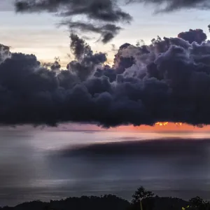 Dramatic sunset with storm clouds over Roseau, Caribbean sea view in Dominica, Lesser Antiles. September 2019