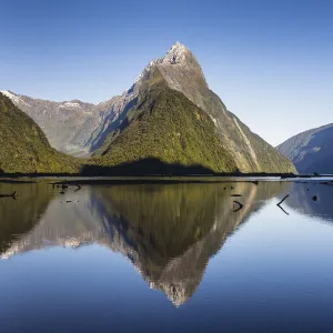 Early morning light on Mitre Peak (1683m) reflected in the calm waters of Milford