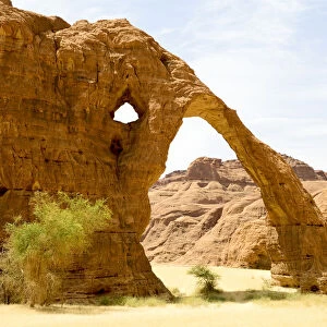 Elephant arch - eroded sandstone rock formation in the Ennedi Natural And Cultural