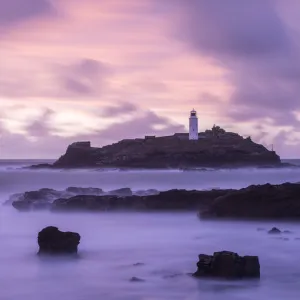 Godrevy Lighthouse at dusk, St. Ives Bay, West Cornwall, England, UK. February 2016