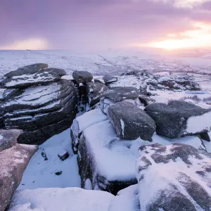 Great Staple Tor covered in snow at dawn, Dartmoor National Park, Devon, England, UK. January 2015