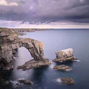 The Green Bridge of Wales sea arch and stack along limestone coastline