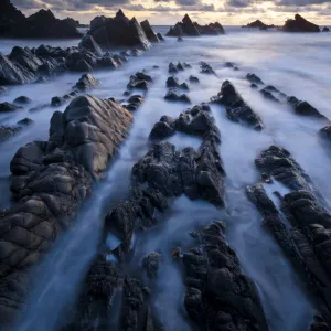 Hartland Quay, rugged north Devon coastline, high tide at sunset, Devon, UK, April 2012