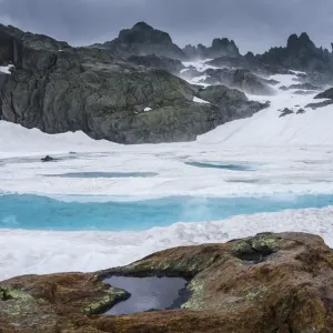 Ice in a mountain lake. Aiguilles Rouges Reserve, Alps, France, July Ice in a mountain lake. Aiguilles Rouges Reserve, Alps, France, July