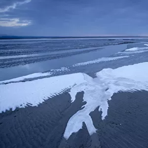 Ice on mudflats, Morecambe Bay, Silverdale, Cumbria, England, UK, February