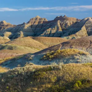 Late afternoon light warms the colors in the Yellow Mounds area, Badlands National Park