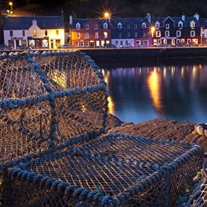 Lobster pots on harbourside at night, Tobermory harbour, Isle of Mull, Scotland