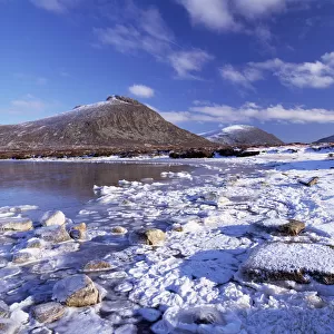 Lough Shannagh with light covering of snow on the beach and Doan peak in the background