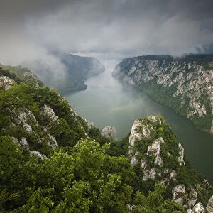 Low clouds over the River Danube flowing through the Iron Gate Gorge, Djerdap National Park