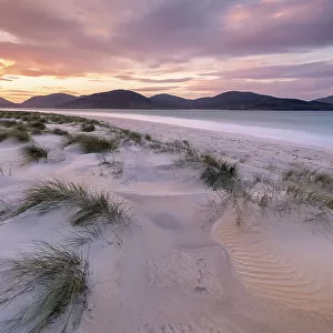 Luskentye beach at sunrise, mountains and incoming tide, Isle of Lewis and Harris, Outer Hebrides, Scotland, UK. October 2018