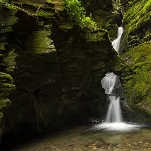 Merlins Well waterfall at St Nectans Glen, near Tintagel, North Cornwall, UK