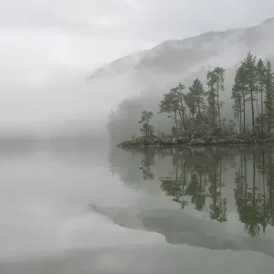 Mist over Teletskoye Lake. Altai Nature Reserve. Golden Mountains of Altai UNESCO World Heritage Site, Russia. July 2013 Mist over Teletskoye Lake. Altai Nature Reserve. Golden Mountains of Altai UNESCO World Heritage Site, Russia. July 2013