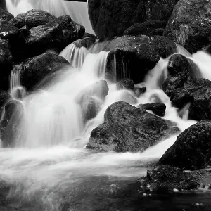 Monochrome image of waterfall breaking on rocks at the base of Lodore Falls, Lake District NP, Cumbria, England, UK, November Monochrome image of waterfall breaking on rocks at the base of Lodore Falls, Lake District NP, Cumbria, England, UK, November