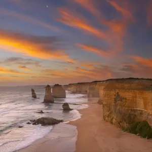The moon over the eroded coastline of the Twelve Apostles at dusk, Port Campbell National Park