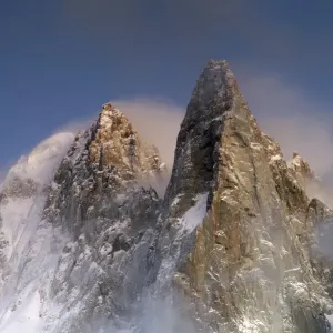 Mountains in snow, Aiguille du Dru with snow blowing off from the top at night. Chamonix Mountains in snow, Aiguille du Dru with snow blowing off from the top at night. Chamonix