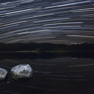 Night sky over Loch Morlich with star trails, Cairngorms National Park, Cairngorms