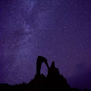 Night sky over Stone arch, called the Julia arch. Ennedi Natural and Cultural Reserve