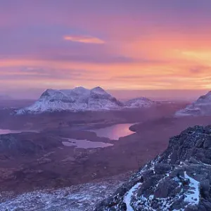 Panoramic view of a colourful winter sunrise from the summit of Stac Pollaidh, Assynt, Highlands of Scotland, UK, January 2016 Panoramic view of a colourful winter sunrise from the summit of Stac Pollaidh, Assynt, Highlands of Scotland, UK, January 2016