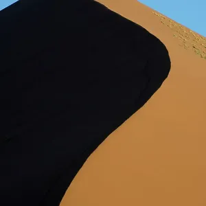 Patterns of shadows and light on sand dunes, Sossusvlei, Namib-Naukluft National Park, Namibia Patterns of shadows and light on sand dunes, Sossusvlei, Namib-Naukluft National Park, Namibia