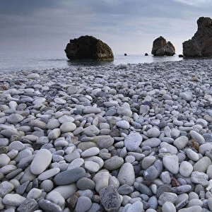 Petra tou Romiou (Aphrodites Rock) Pissouri Bay pebble beach, near Paphos, Cyprus