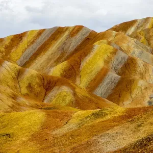 Rainbow Mountains, strata within eroded hills of sedimentary conglomerate and sandstone Rainbow Mountains, strata within eroded hills of sedimentary conglomerate and sandstone