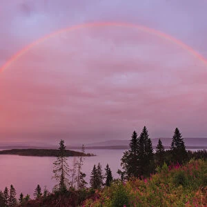 Rainbow over Snsavatnet, at dusk, Nord-Tronelag, Norway, July
