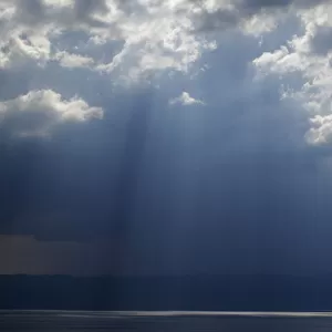 Ray of light shining through thunder clouds over Lake Ohrid, Galicica National Park