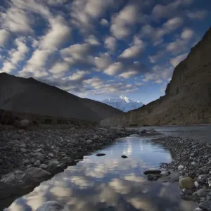 Reflection of clouds in water next to the Kali Ghandaki river, Nilgiri range, Chhusang Reflection of clouds in water next to the Kali Ghandaki river, Nilgiri range, Chhusang