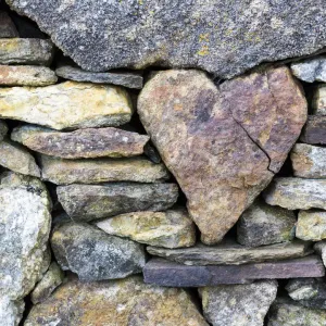 Heart-shaped stone print in a wall Heart-shaped stone print in a wall