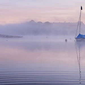 RF - Sailing boat in morning mist, reflected in Wimbleball Lake