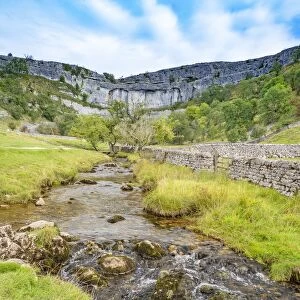 River at base of limestone pavement. Malham Cove, Yorkshire Dales National Park, England