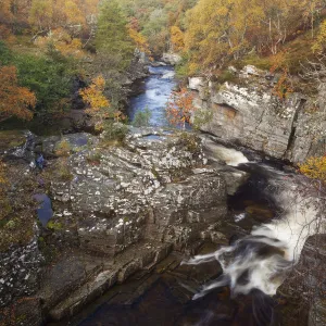 River Tromie flowing through a small gorge in autumn. Cairngorms, Scotland, October 2009