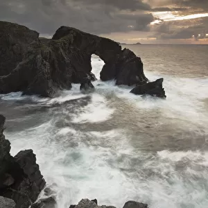 Rock archway at sunset, Isle of Lewis, Outer Hebrides, Scotland, UK, September 2014