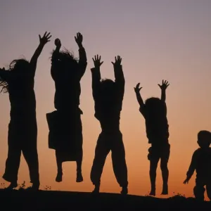 Silhouette of five leaping Children, Bohuslan archipelago, Sweden Silhouette of five leaping Children, Bohuslan archipelago, Sweden