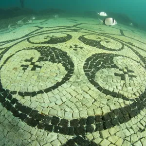 Detail of splendid ancient Roman tessellatum mosaic in black and white decorated with pattern of hexagons, perfectly preserved, in Villa a Protiro. Marine Protected Area of Baia, Naples, Italy. Tyrrhenian sea