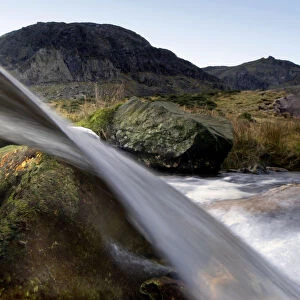 A split-level view through a small waterfall, Llanberis, Snowdonia NP, Gwynedd, Wales
