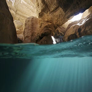 Split level view of water in cave in Wadi Al Shab, Al Sharqiyah South Governorate