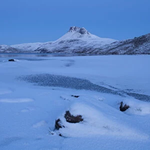 Stac Pollaidh at dawn, with frozen Loch Lurgainn in foreground, Coigach, Wester Ross