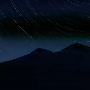 Star trails over Mount Elbrus (5, 642m) at night, Caucasus, Russia, June 2008